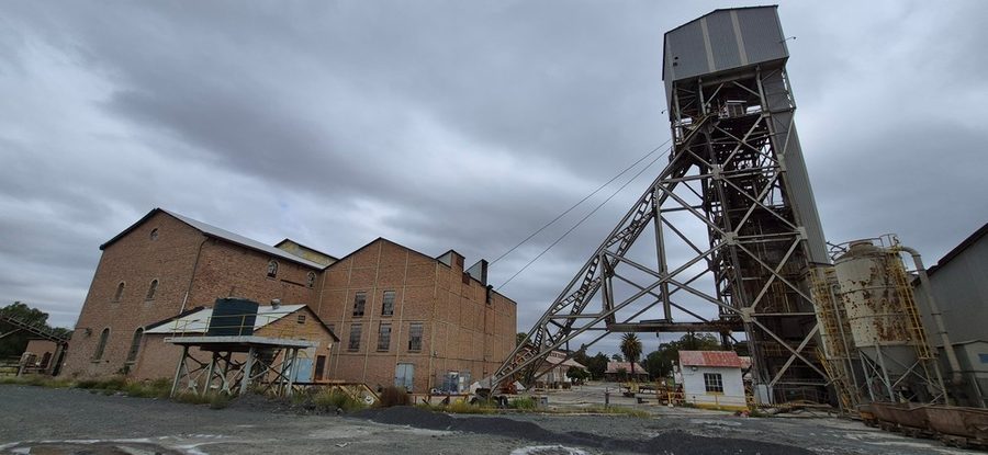 Du Toitspan Shaft Headgear — steel headframe with historic brick winding house