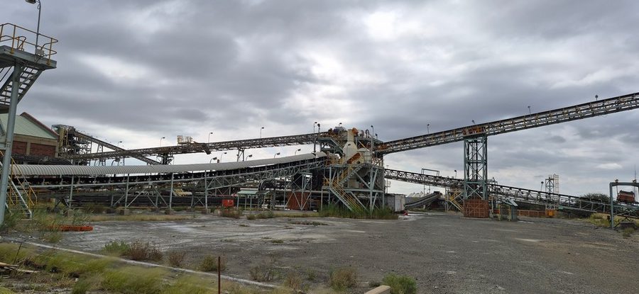 CTP Conveyor Network — overland conveyor system alongside water retention pond